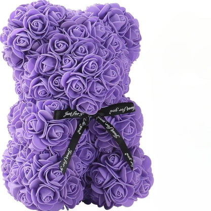 A purple teddy bear made out of eternal flowers.