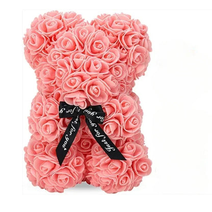 A rose teddy bear made out of eternal flowers.